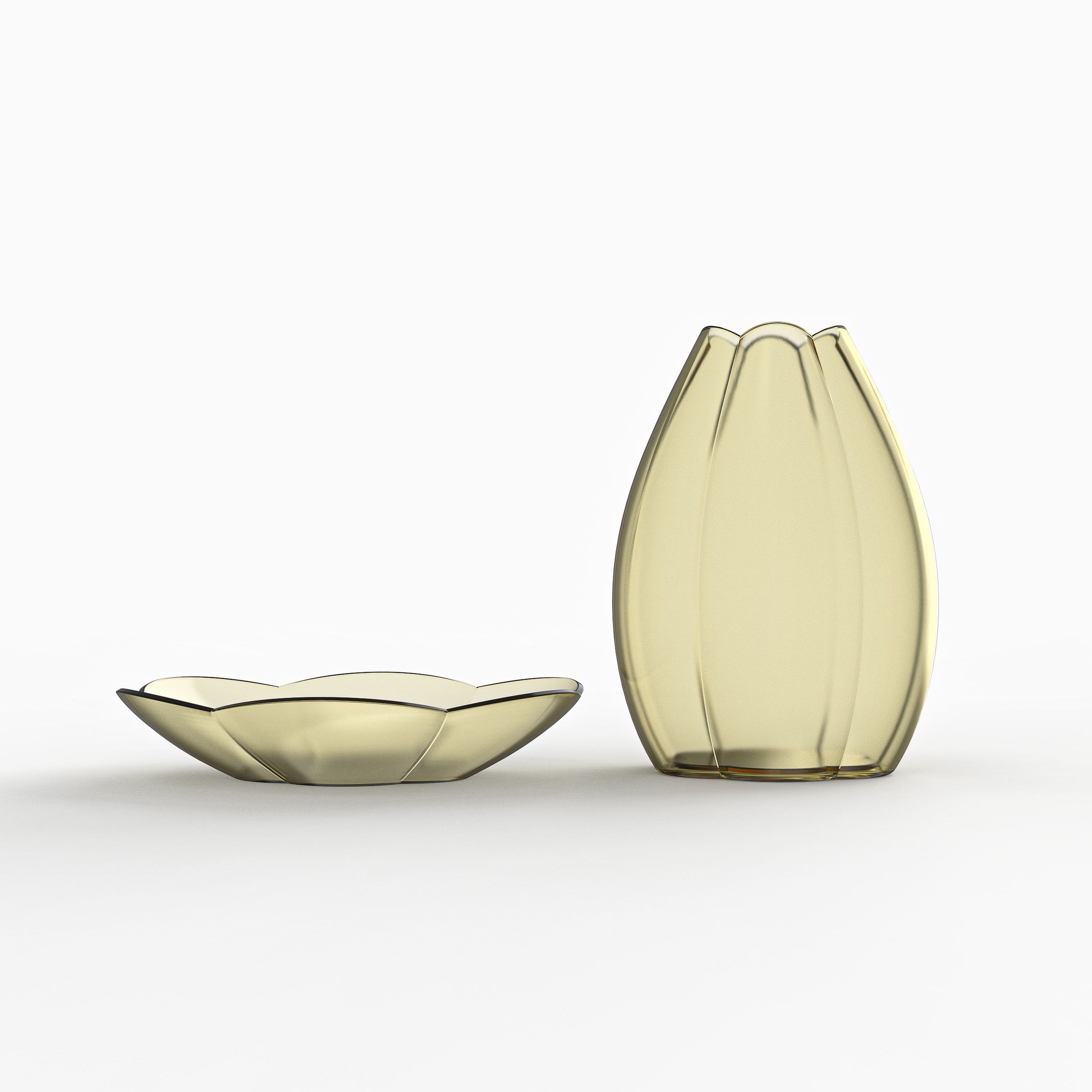 A ribbed amber glass vase shaped like a tulip bud, standing beside a shallow scalloped amber glass dish on a white surface.